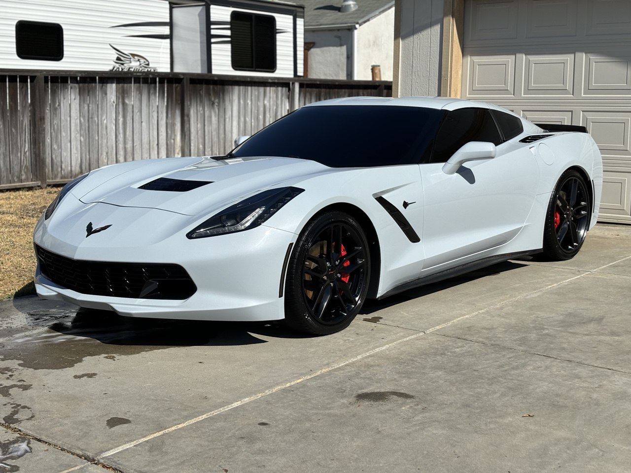White Corvette Stingray front quarter view after full detail